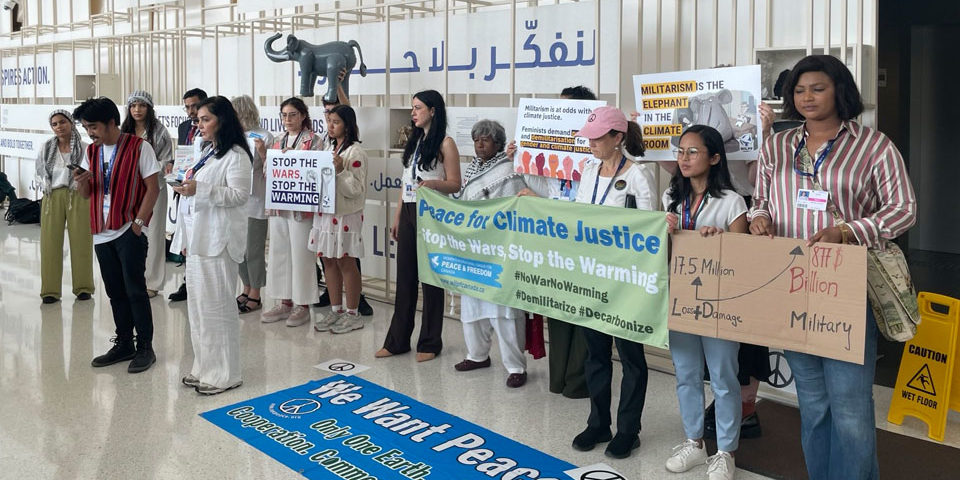 WILPF-protest_COP28_web_960 Campaigners protect about militarism and the climate crisis at COP28.