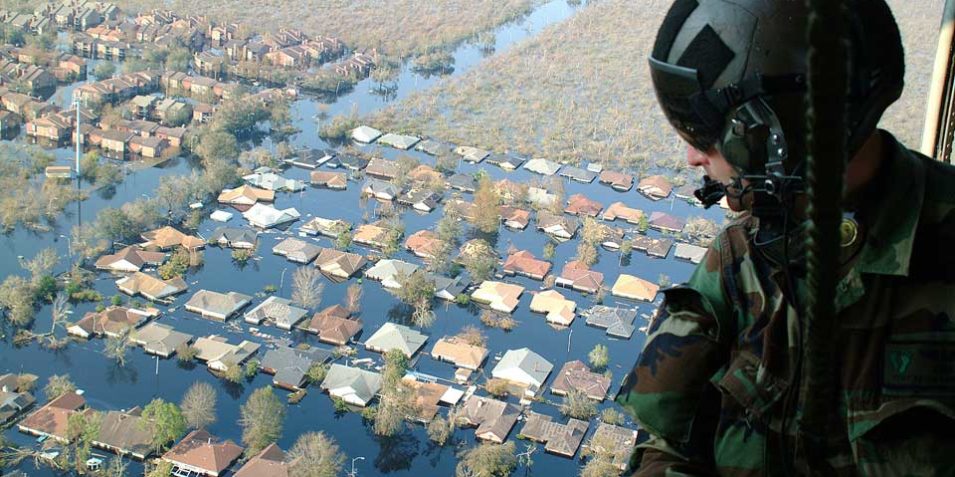 US-army-image—helicopter_960 A soldier looks out of a helicopter above the Hurrican Katrina floods, which have engulfed residential areas of New Orleans.