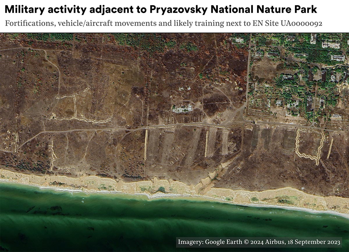A single optical satellite image of fortifications on the Pryazovskyi National Nature Park. The area shown comprises coastal dunes and scrub, strips of trenches can be seen due to the lighter sandy soil, there are extensive workings in the fragile area, the beach and sea are visible in the lower part of the image.